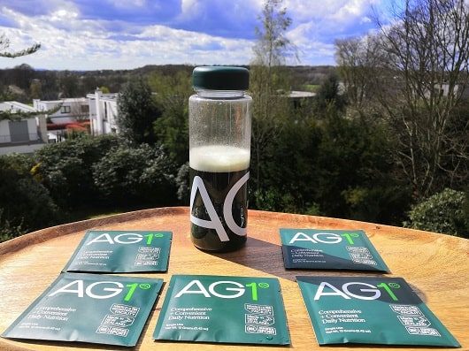 ag1-bottle-by-athletic-greens with travel packs for free